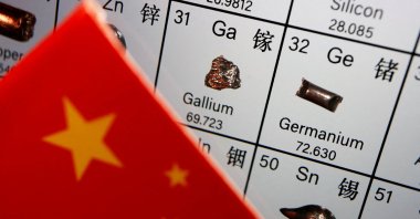 The flag of China is placed next to the elements of gallium and germanium on a periodic table, in this illustration picture taken on July 6, 2023. (Reuters Photo)