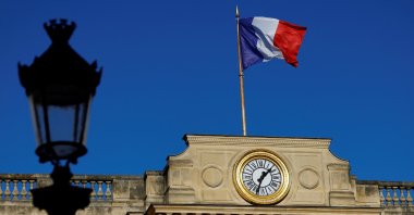 A French national flag flies over the National Assembly in Paris, France, Nov. 28, 2024. (Reuters Photo)