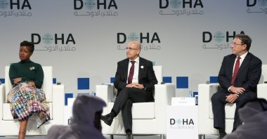 Treasury and Finance Minister Mehmet Şimşek (C) attends a panel at Doha Forum 2024, Doha, Qatar, Dec. 7, 2024. (AA Photo)