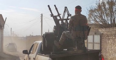Syrian National Army (SNA) members advance in villages near central Manbij, Syria, Dec. 8, 2024. (AA Photo)