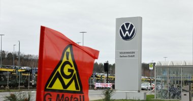 The flag of IG Metall union flutters in front of the plant of German car maker Volkswagen as thousands of Volkswagen workers go on strike all over Germany, Zwickau, Germany, Dec. 2, 2024. (AFP Photo)