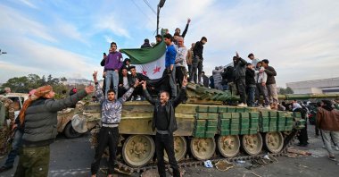 People celebrate with anti-regime fighters at Umayyad Square in Damascus, Syria, Dec. 8, 2024. (AFP Photo)