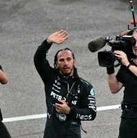 Mercedes' British driver Lewis Hamilton greets fans after the Abu Dhabi Formula One Grand Prix at the Yas Marina Circuit, Abu Dhabi, UAE, Dec. 8, 2024. (AFP Photo)