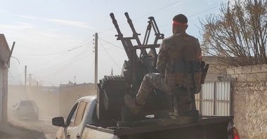 A Syrian National Army (SNA) vehicle advances into the district center of Manbij as they fight against the PKK/YPG terrorist group, northern Syria, Dec. 8, 2024. (AA Photo)