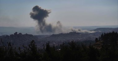 Smoke billows following an Israeli airstrike on the outskirts of Damascus, Syria, Dec. 8, 2024. (AFP Photo)