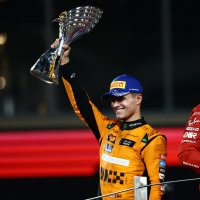 McLaren's Lando Norris celebrates on the podium with a trophy after winning the Abu Dhabi Grand Prix, Abu Dhabi, UAE, Dec. 8, 2024. (Reuters Photo)