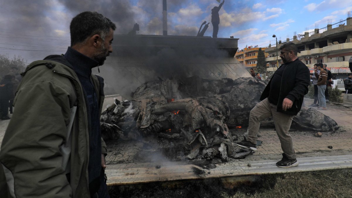 Syrians destroy the statue of Basel Assad, the late elder brother of Syria&#039;s Bashar Assad, as they celebrate the fall of capital Damascus to anti-regime forces, Qamishli, Syria, Dec. 8, 2024. (AFP Photo)