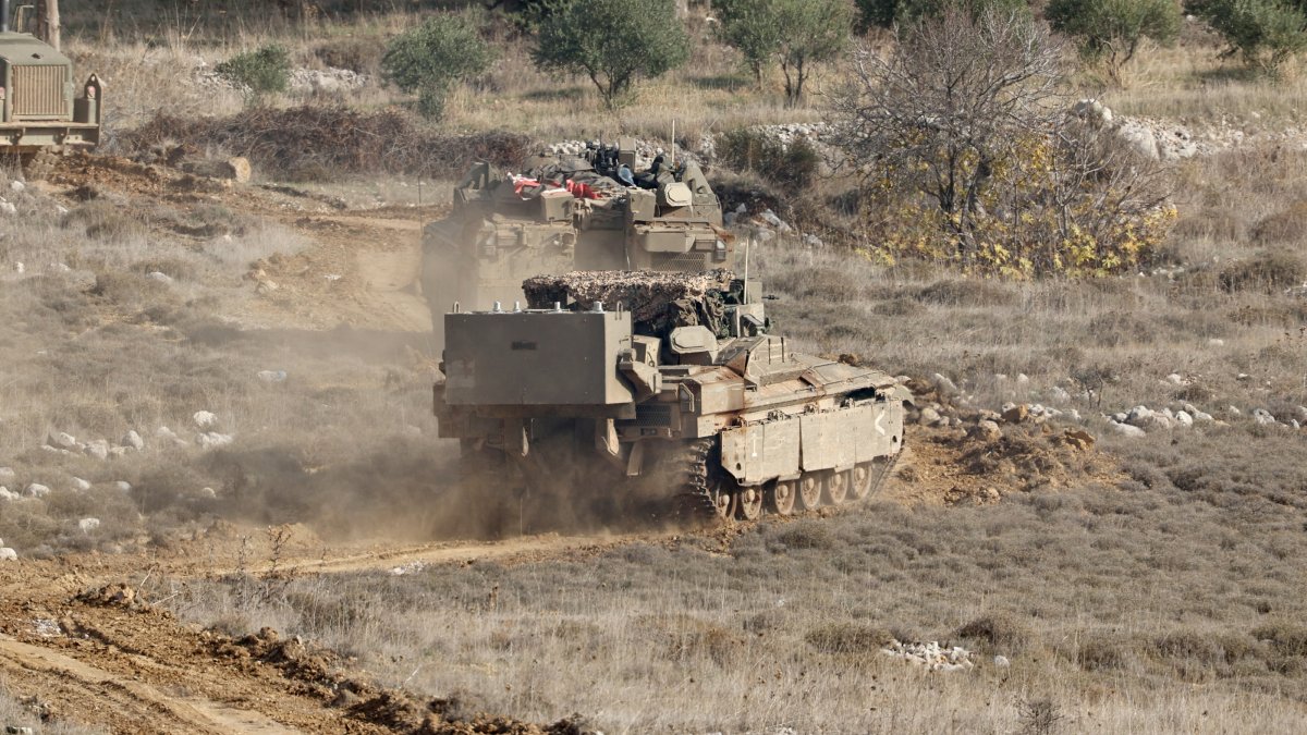 Israeli troops cross into the Syrian side of the border near the Druze village of Majdal Shams, in the Israeli-annexed Golan Heights, Dec. 9, 2024. (EPA Photo)