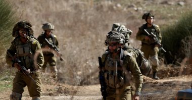 Israeli troops move on the Syrian side of the border near the Druze village of Majdal Shams, in the Israeli-annexed Golan Heights, Dec. 9, 2024. (EPA Photo)