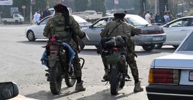 Anti-regime forces patrol a street in Damascus, Syria, Dec. 10, 2024. (AFP Photo)