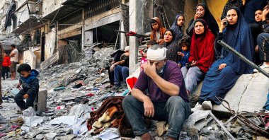 An injured man reacts while sitting on the rubble of a building hit by an Israeli strike in Beit Lahia, northern Gaza Strip, Palestine, Oct. 29, 2024. (AFP Photo)