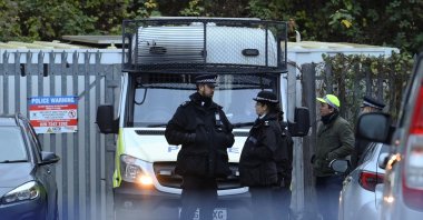 Police officers stand outside a Kurdish community center after a counterterrorism investigation into suspected activity linked to the PKK terrorist group, London, Britain, Nov. 27, 2024. (Reuters Photo)