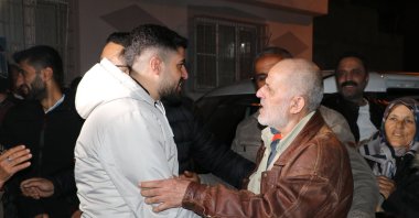 Mehmet Ertürk (R) hugs family members in Kilis, southeastern Türkiye, Dec. 9, 2024. (AA Photo)