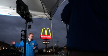 A television reporter broadcasts from outside a McDonald&#039;s restaurant where a suspect in the killing of UnitedHealth executive Brian Thompson, identified as Luigi Mangione, 26, was arrested in Altoona, Pennsylvania, U.S., Dec. 9, 2024. (Reuters Photo)