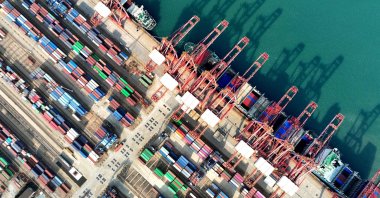A container ship is loaded at the port in Lianyungang, eastern Jiangsu province, China, Dec. 10, 2024. (AFP Photo)