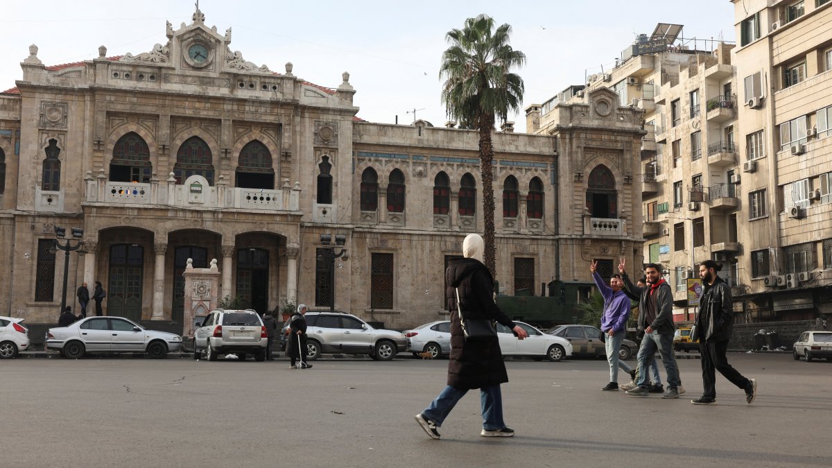 People walk along a street, after opposition forces seized the capital and ousted Syria&#039;s Bashar Assad, Damascus, Syria, Dec. 11, 2024. (Reuters Photo)