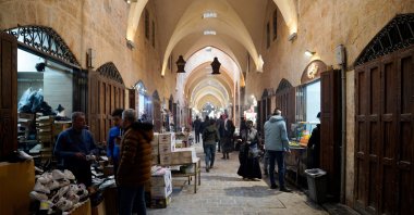 People walk at a souk after Syrian anti-regime forces announced that they had ousted Bashar Assad, Aleppo, Syria, Dec. 9, 2024. (Reuters Photo)