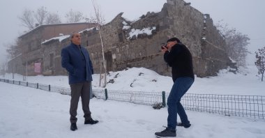 French anthropologist Victor Dallant takes a photo of Ahmet Özmen, 44 years after taking his photo at the same location following their reunion, in Erzurum, eastern Türkiye, Dec. 10, 2024. (IHA Photo)