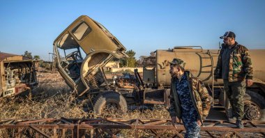 PKK/YPG terrorists inspect damaged and abandoned vehicles at the Qamishli International Airport, formerly a joint Syrian-Russian military base, in the northeastern city of Qamishli, Syria, Dec. 9, 2024. (AFP Photo)
