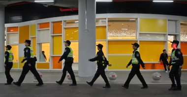 Police ahead of the World Cup qualification football match between China and Japan, Xiamen, China, Nov. 19, 2024. (AFP Photo)