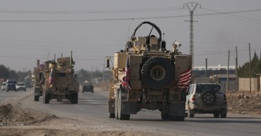 An American flag flutters on U.S. military vehicles, Hassakeh, Syria, Dec. 6, 2024. (Reuters Photo)