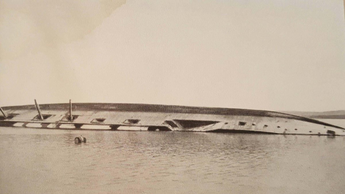 The capsized Ottoman battleship Mesudiye floats on the surface after being struck by torpedos from the British submarine B-11 during World War I. (DHA Photo)