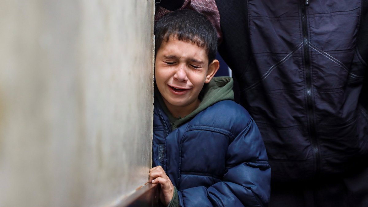 A Palestinian boy mourns relatives killed in an Israeli strike, in Nuseirat, central Gaza Strip, Palestine, Dec. 11, 2024. (Reuters Photo)
