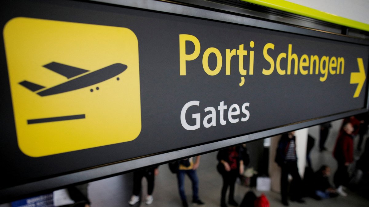 Airport signage showing passengers the route to the Schengen gates at Henri Coanda International Airport near Bucharest, Romania, March 28, 2024. (Reuters Photo)