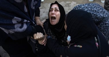 Palestinians mourn next to the bodies of their relatives who were killed in an Israeli airstrike, Khan Younis, southern Gaza Strip, Dec. 12, 2024. (EPA Photo)
