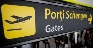 Airport signage showing passengers the route to the Schengen gates at Henri Coanda International Airport near Bucharest, Romania, March 28, 2024. (Reuters Photo)