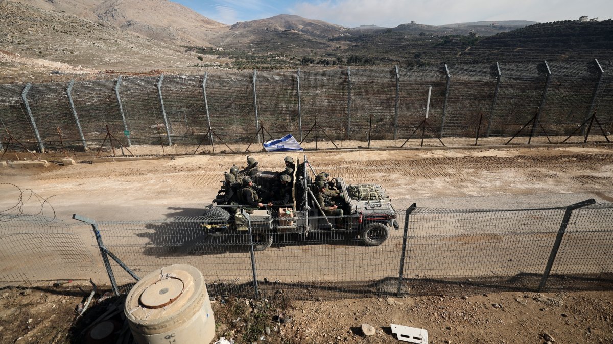 An Israeli vehicle moves along a road toward the Syrian side of the border between Israel and Syria near the Druze village of Majdal Shams, in Golan Heights, Syria, Dec. 12, 2024. (EPA Photo)