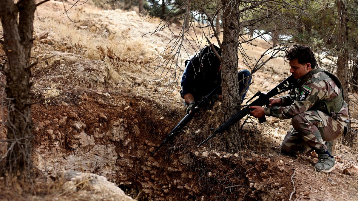 Syrian National Army (SNA) soldiers investigate tunnels used by PKK/YPG terrorists in liberated Manbij, Aleppo, Syria, Dec. 12, 2024. (AA Photo)