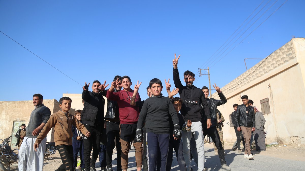 Syrians celebrate after the Syrian National Army (SNA) liberates the town of Manbij from PKK/YPG terrorists, Aleppo, Syria, Dec. 10, 2024. (AA Photo)