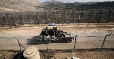 An Israeli vehicle moves along a road toward the Syrian side of the border between Israel and Syria near the Druze village of Majdal Shams, in Golan Heights, Syria, Dec. 12, 2024. (EPA Photo)