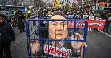 Demonstrators from a labor group take part in a protest calling for the ouster of South Korean President Yoon Suk Yeol outside city hall, Seoul, South Korea, Dec. 12, 2024. (AFP Photo)