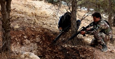 Syrian National Army (SNA) soldiers investigate tunnels used by PKK/YPG terrorists in liberated Manbij, Aleppo, Syria, Dec. 12, 2024. (AA Photo)