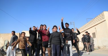 Syrians celebrate after the Syrian National Army (SNA) liberates the town of Manbij from PKK/YPG terrorists, Aleppo, Syria, Dec. 10, 2024. (AA Photo)