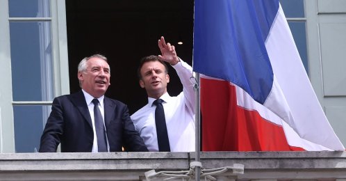 French President Emmanuel Macron (R) poses with Democratic Movement party President Francois Bayrou and Pau Mayor Francois Bayrou (L) on the balcony of the city hall, Pau, France, July 6, 2023. (AFP Photo)