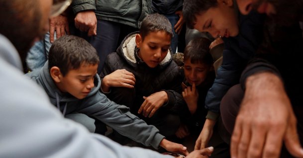 Palestinians mourn relatives killed in an Israeli strike, amid the ongoing conflict between Israel and Hamas, in Nuseirat, Gaza Strip, Palestine, Dec. 11, 2024. (Reuters Photo)