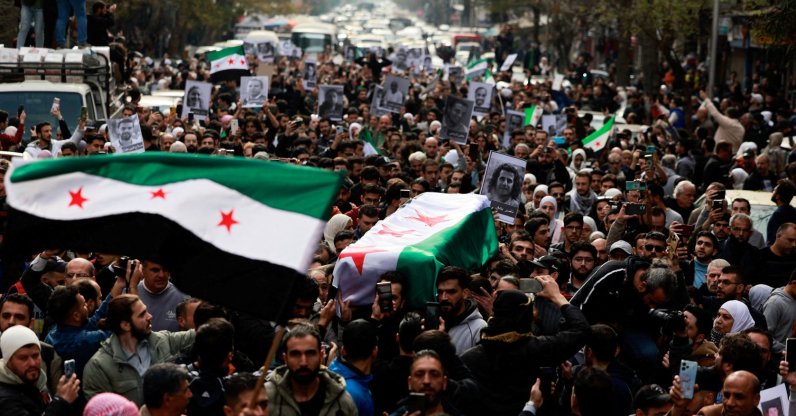 People carry the body of Syrian activist Mazen al-Hamada, who according to Syrian activists was found dead in a prison, Damascus, Syria, Dec. 12, 2024. (Reuters Photo)