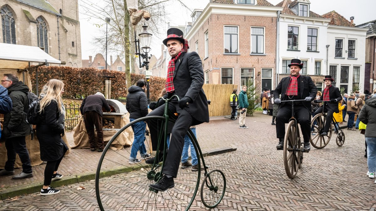 Actors ride the penny-farthing bicycle during the Dickens Festival in Deventer, The Netherlands, Dec. 14, 2024. (EPA Photo)