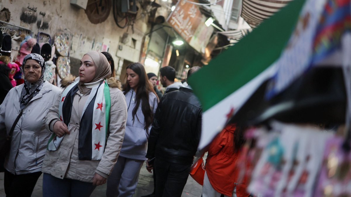 People walk at a traditional souq in the Bab Touma district of the Old City of Damascus, Syria, Dec. 14, 2024. (Reuters Photo)