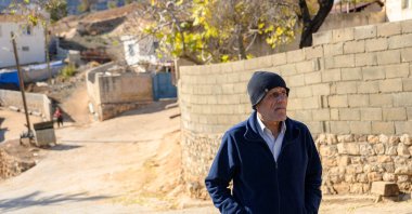 Mehmet Ertürk walks in his village in Kilis, southern Türkiye, Dec. 13, 2024. (AFP Photo)