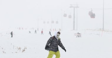 A skier with a cartoon mask on the slopes of Erciyes, Kayseri, Türkiye, Dec. 15, 2024. (AA Photo)