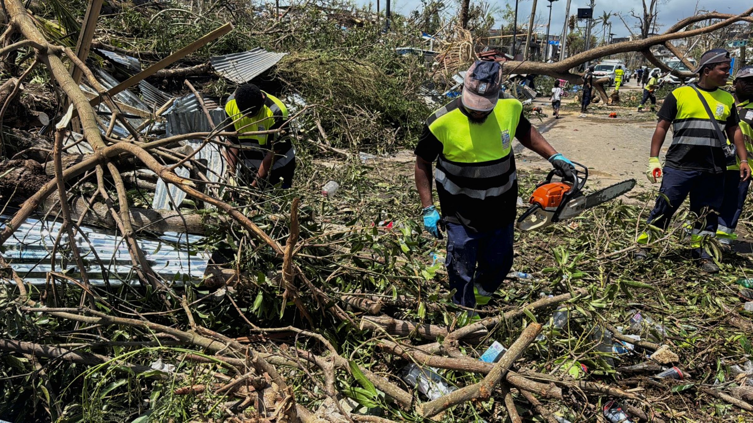 Rescue workers attempt to clear a blocked road, in the aftermath of Cyclone Chido, within Labattoir, in Mayotte, France, Dec. 15, 2024. (Reuters Photo)