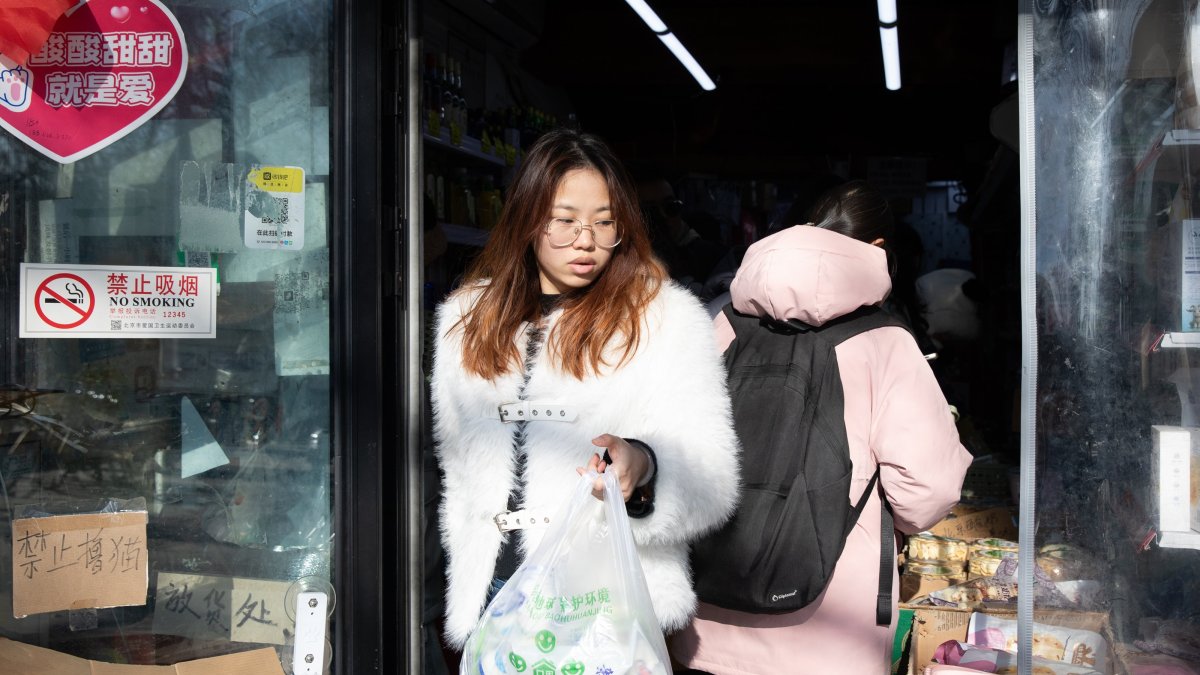 People shop at a market in Beijing, China, Dec. 9, 2024. (EPA Photo)