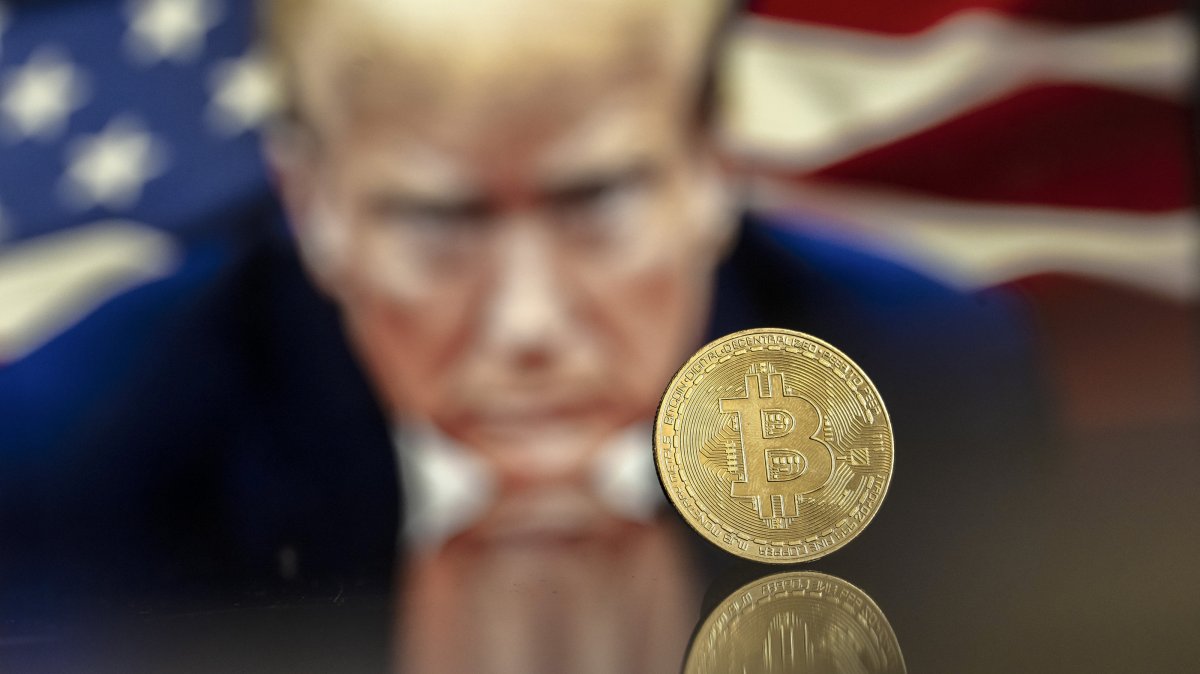 An illustration shows a Bitcoin mockup in front of an image of U.S. President-elect Donald Trump, Nov. 22, 2024. (EPA Photo)