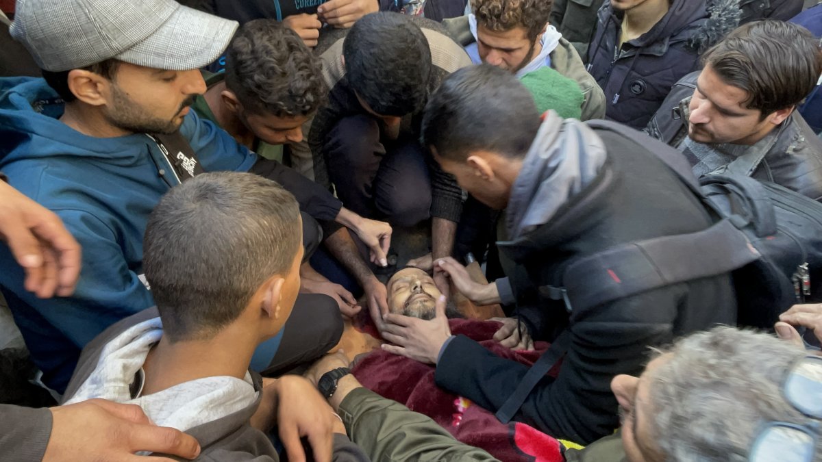 Khaled Nabhan&#039;s lifeless body is taken from the morgue of Awde Hospital for funeral prayers and burial after an Israeli attack at the Nuseirat refugee camp in Gaza City, Dec. 16, 2024. (AA Photo)