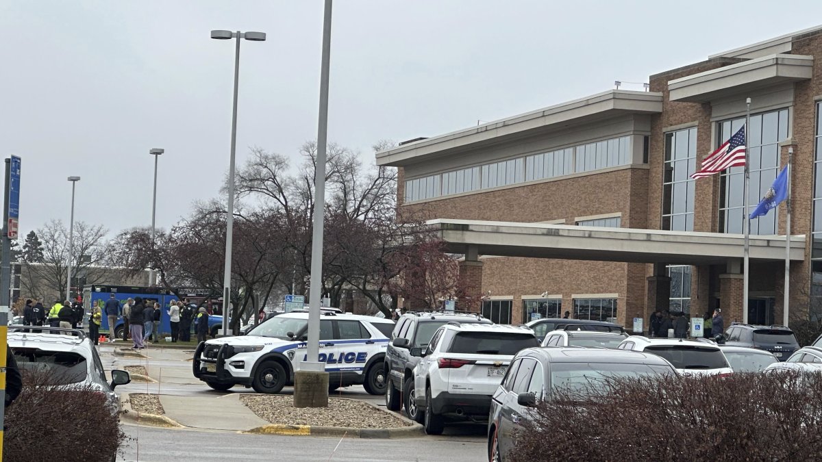 Emergency vehicles are parked outside of the SSM Health clinic where parents are being reunified with children after a shooting at the Abundant Life Christian School in Madison, Wis., Monday, Dec. 16, 2024. (AP Photo)