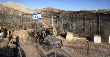 An Israeli military vehicle rides by the cease-fire line between the Israeli-occupied Golan Heights and Syria, Dec. 15, 2024. (Reuters Photo)